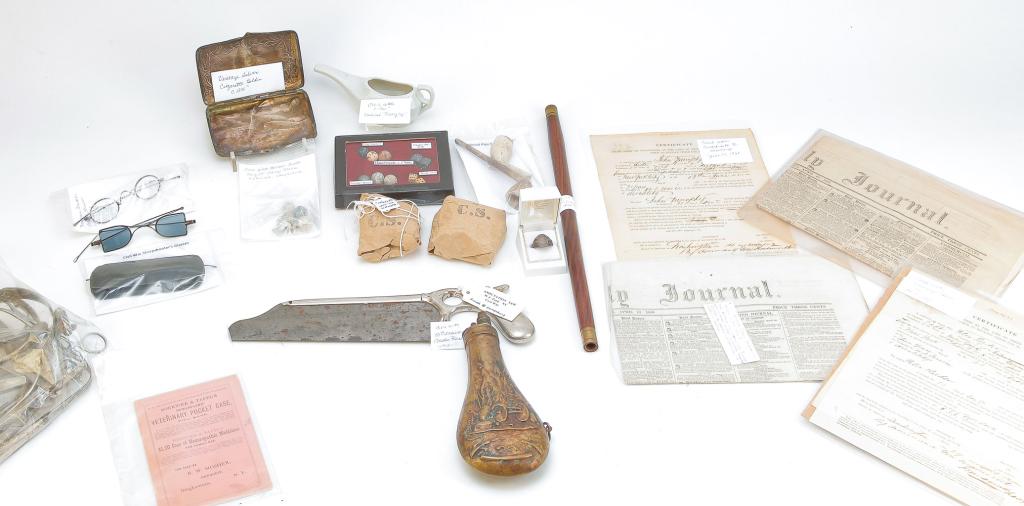 GROUP OF MOSTLY AMERICAN CIVIL WAR ERA ITEMS.: Mid 19th-early 20th century. Dug relics including surgeon's saw, ring, minni balls and dice, clay pipe fragments, medical instruments, spectacles including Franklin's patent and sharpshooting glasses,