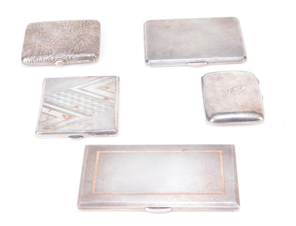 FIVE ENGLISH SILVER POCKET CASES.: Twentieth century. Plain with monogram, Birmingham. 3"h. 2.5"w., textured, 3.5h. 3"w., Art Deco pattern, Birmingham, 3.25"h. 3.75"w., checkered 4.5"h. 3.5"w., And checkered with rose gold inlaid recta