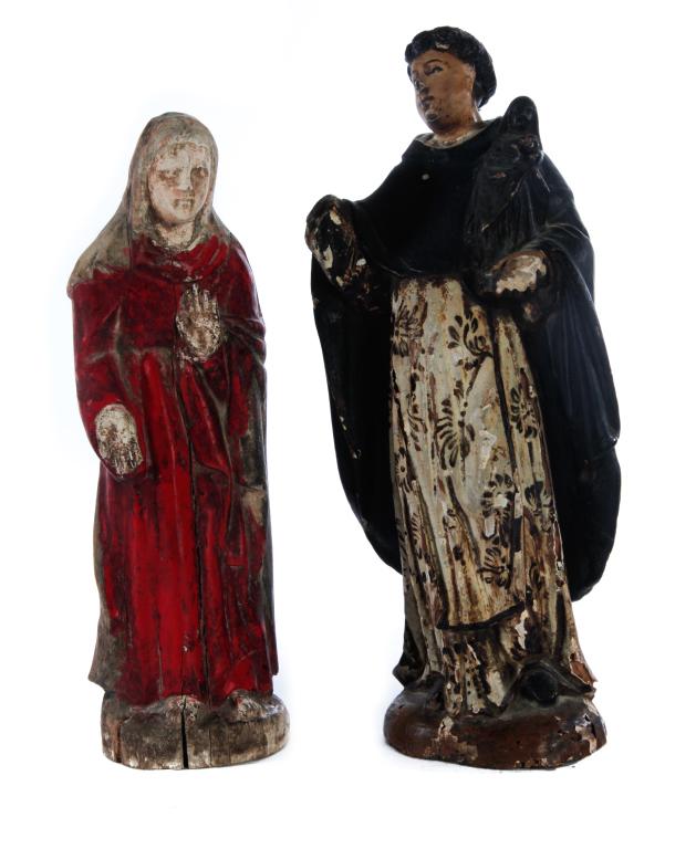 TWO SANTOS.: Central/South America, late 19th century. Carved wooden figures with original paint over gesso. Mary, dressed in red, 10.25"h. And St. Anthony in black cloak with inset glass eyes. 11.5"h. Varying imp