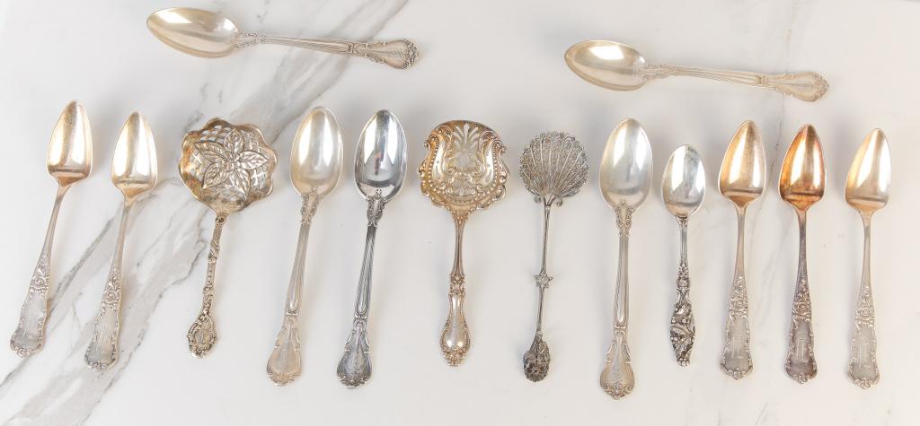 FOURTEEN PIECES OF AMERICAN STERLING.: Nineteenth-20th century. Five Gorham "Chantilly" teaspoons, five dessert spoons with vermeil bowls, Simpson, Hall & Miller demitasse with holly handle, Gorham vermeil reticulated nut server, Blackingt