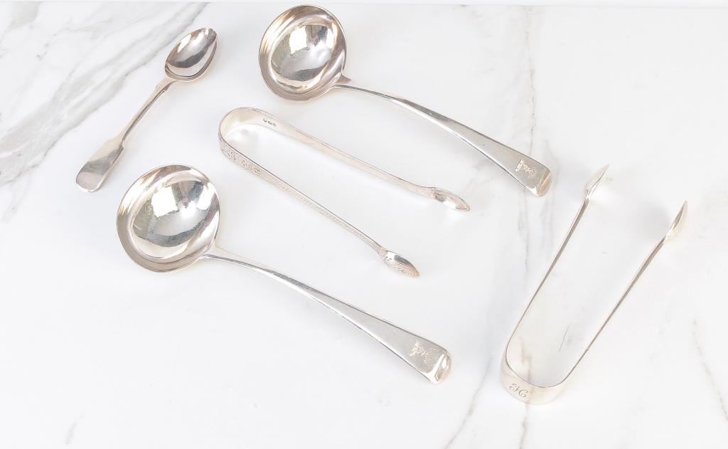FIVE PIECES OF LONDON ENGLAND SILVER.: Nineteenth century. Pair of ladles 1803-1804 with maker mark "VS", plain tongs 1900-1901 and bright work tongs 1831-1832 and a teaspoon 1922. Approx. 5 ozt.
