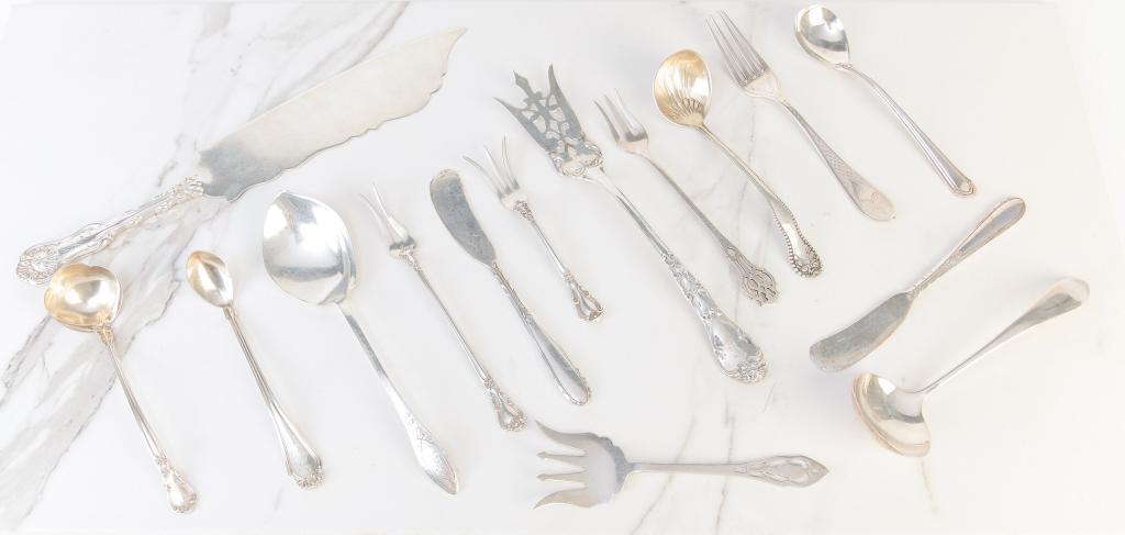GROUP OF MISC. AMERICAN STERLING ITEMS.: NIneteenth-20th century. Forks, ladles, butter spreaders, sauce spoons, cake knife etc by Gorham, Dominick & Haff, Whiting, Oneida and others. Approx. 13 ozt.
