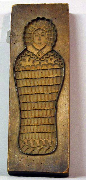 WOODEN COOKIE BOARD. Swaddled baby with a