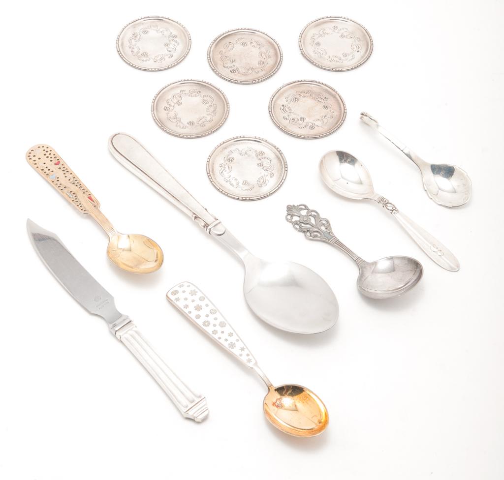 GROUP OF SCANDINAVIAN SILVER.: Twentieth century. All marked 925 or Sterling. One spoon marked for Thorvald Mathinsen, Norway. The rest are Denmark. Six Georg Jensen butter pats, 2.25"d. and one spoon with beaded detail, spoon by F