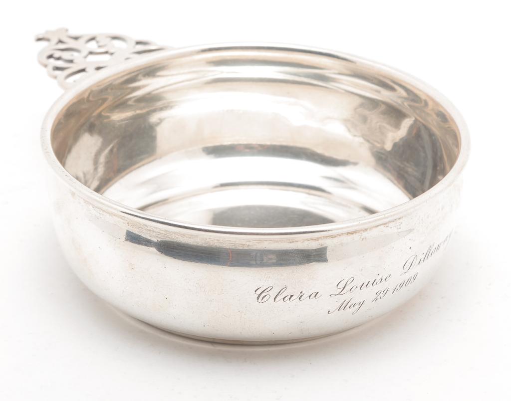 AMERICAN GORHAM "STERLING" PORRINGER: Early 20th century. Pierced handle, marked on the underside. Inscribed "Clara Louise Dillaway, May 29, 1909". 4.75"d. Approx. 5.7 ozt.