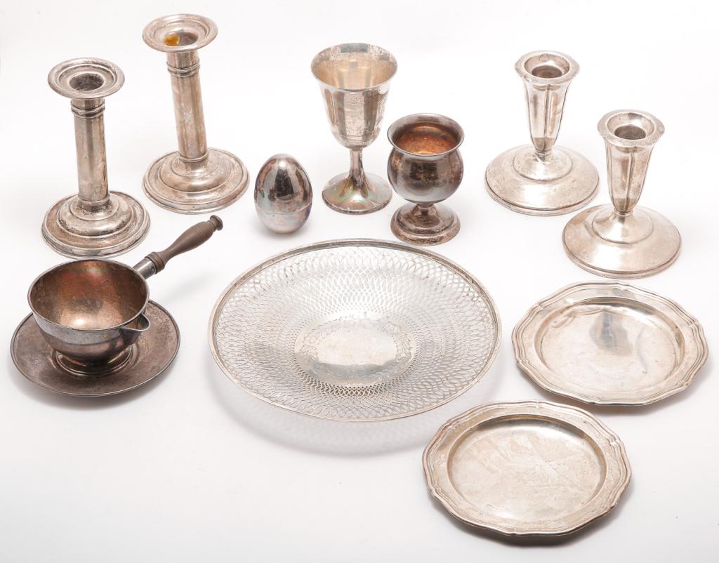 SILVER GROUP INCLUDING "STERLING".: Twentieth century. Sterling unless otherwise noted. Two pair weighted candlesticks, Gorham, 5.5"h. and El-Sil-Co, 4.25"h., Gorham wine, 4.75"h., a snifter and sauce with wooden turned handle, "Silver 