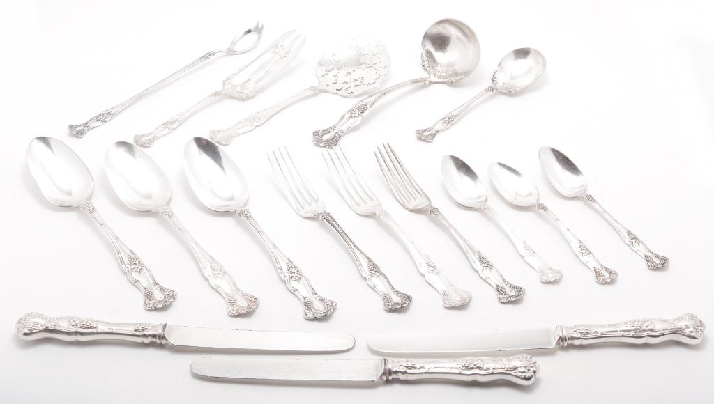 ROGERS BROS. SILVERPLATE FLATWARE.: American, patent date 1847 on handles. Grape pattern. Eight forks, ten teaspoons, one tablespoon, nine serving spoons, six luncheon knives and three dinner knives. With five serving pieces. In a fitte
