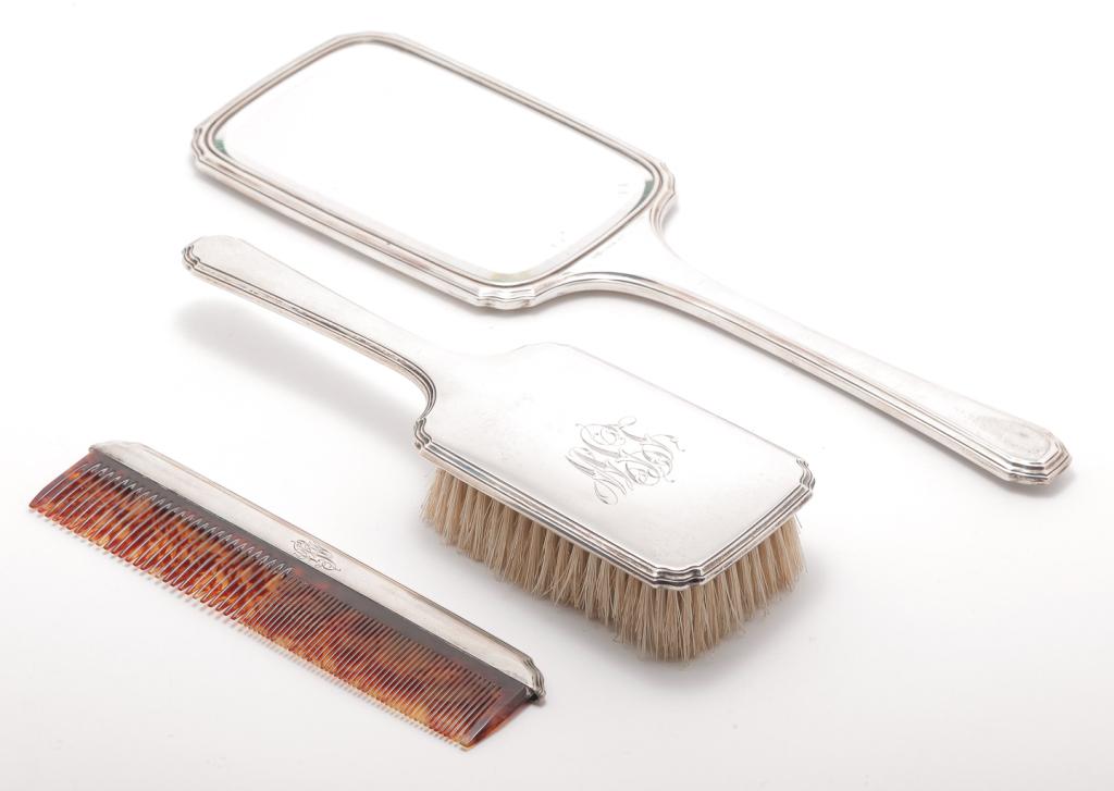 THREE PIECE AMERICAN "STERLING" DRESSER SET.: First quarter 20th century. Beveled edge hand mirror, 13.5"l., brush and comb all with sterling backs marked for R. Wallace. Matching pattern with monogram.