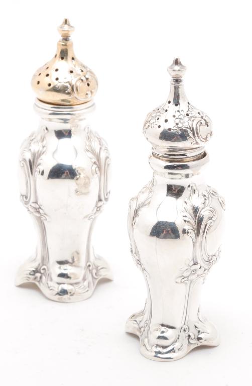 PAIR OF "STERLING" SALT AND PEPPER SHAKERS.: Late 19th-eary 20th century. "Gorham" with floral decoration and one vermeil lid. 4.5"h. Approx. 4 ozt.