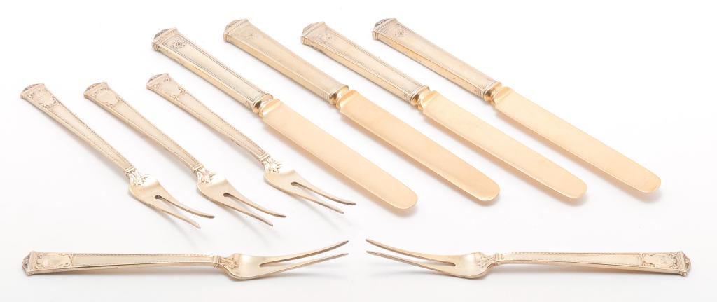 NINE PIECES OF TIFFANY STERLING VERMEIL FLATWARE.: First quarter 20th century. Windham pattern. Four hollow handled dessert knives and five, two prong forks "Tiffany & Co. Sterling Pat. 1918 M". All with vermeil surface and monograms. 6.25", 7.25"l.