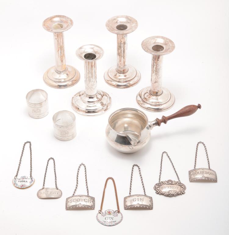 GROUP OF SILVER INCLUDING DUHME.: American and English, late 19th-20th century. Pair of "Duhme & Co." napkin rings, 1.5"h., "Fisher Sterling" sauce with turned wooden handle, 7"l. and four weighted "Sterling" candlesticks. Three have