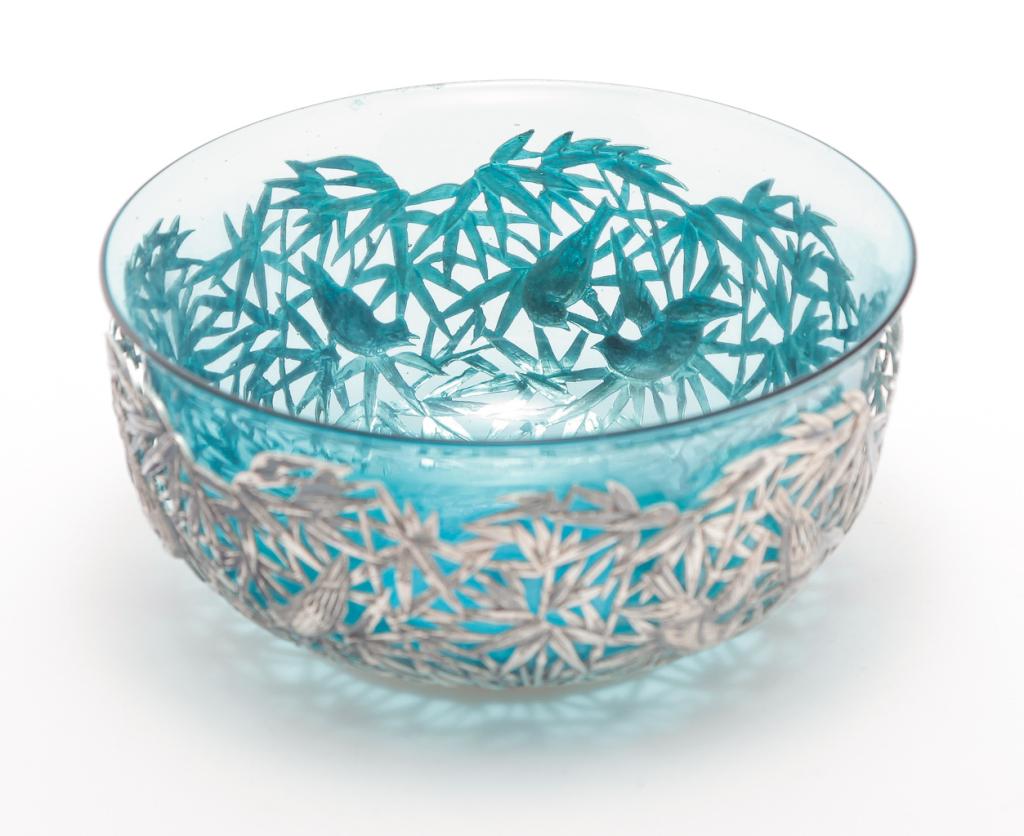 CHINESE EXPORT SILVER HOLDER WITH BOWL.: Hallmarked for "Luen Wo, Shanghai", late 19th-early 20th century. Reticulated holder with bamboo and birds. 2"h.4.5"d. Holds a blue glass bowl (small split). 2.5"h. 5"d. overall.