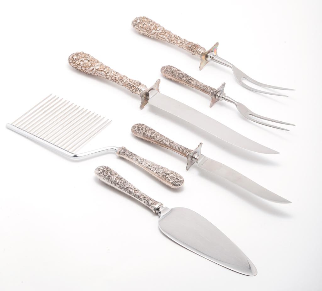 SIX "STERLING" FLATWARE SERVICE PIECES.: American, 20th century. Hollow handles. Four "S. Kirk & Son" repousse pattern, carving set, cake cutter and server, 10"l. And a similar floral pattern carving fork and knife by "Stieff". 12", 14"l.