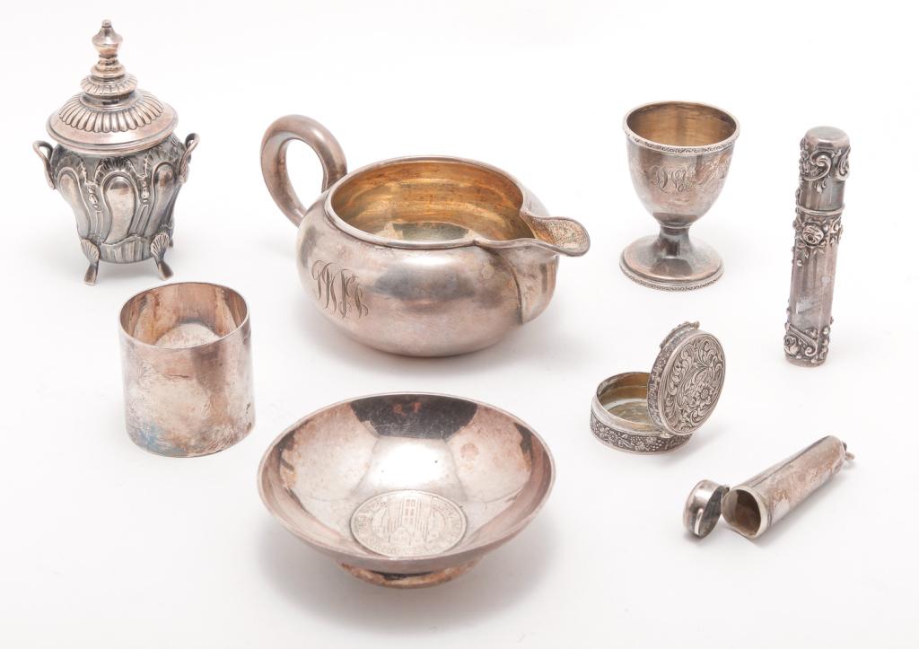 EIGHT ASSORTED PIECES OF SILVER.: Nineteenth-20th century. Russian sauce boat with assayer's mark "BC 1871", 2.5"h., Gorham sterling needle case, 3.5"l., Italian snuff or powder box "Peruzzi 800", 1.25"d., covered jar with shell feet 