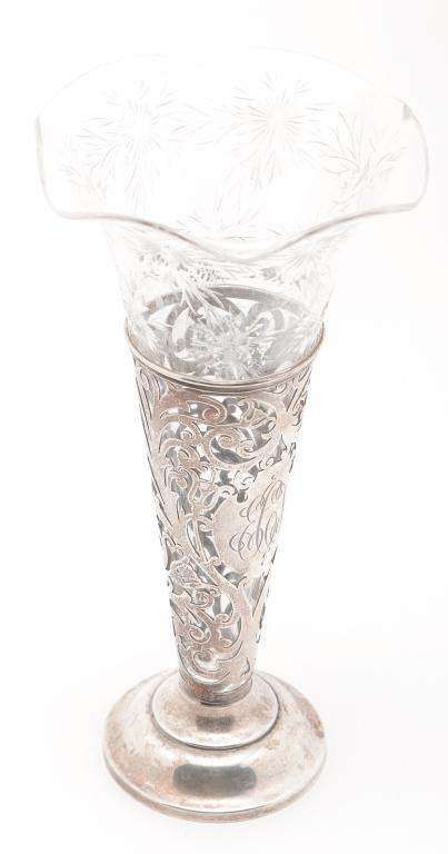 AMERICAN STERLING AND GLASS VASE.: Early 20th century. Reticulated "Sterling" base with monogram and a glass trumpet vase with engraved flowers. Silver mark might be for Watson. 11.5"h. Approx. 6 ozt.