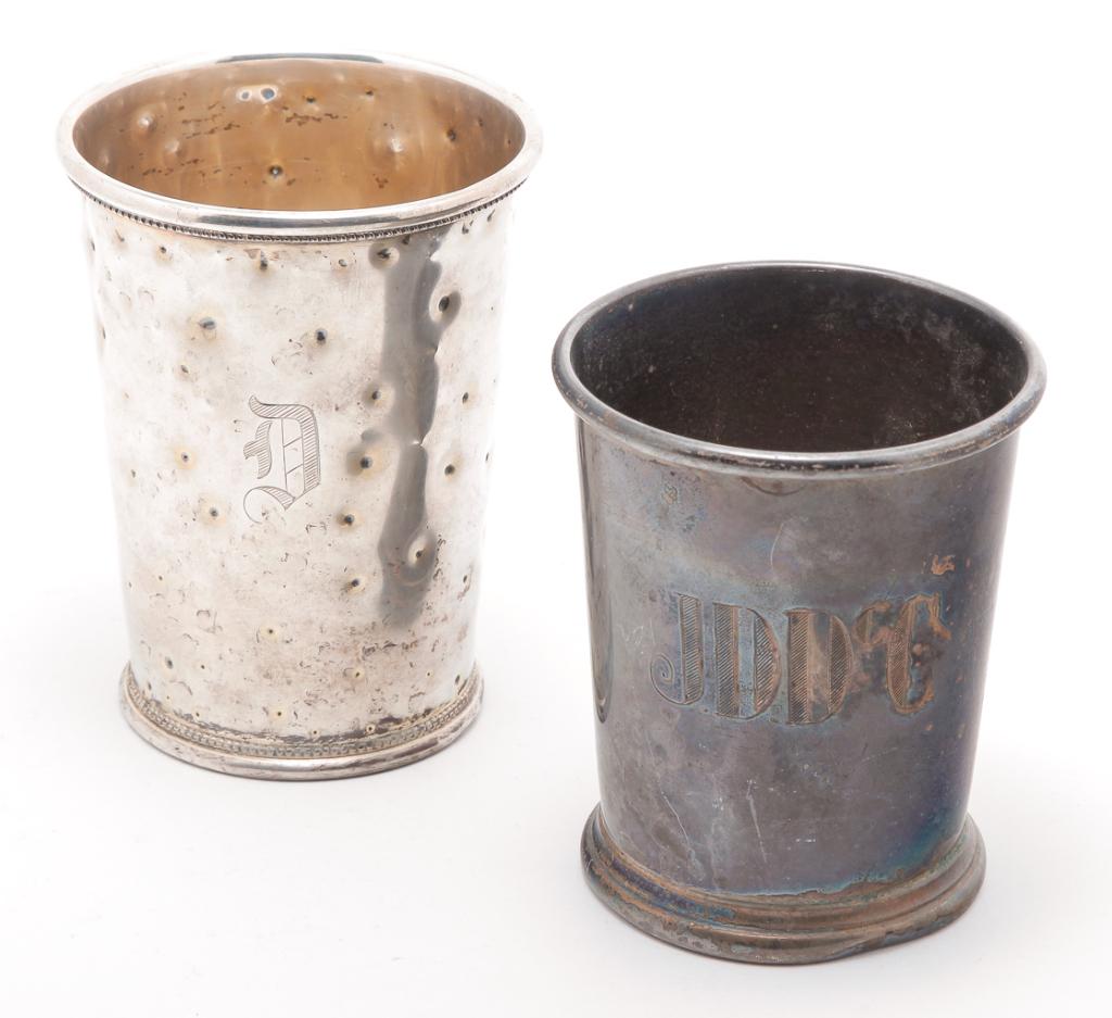 TWO AMERICAN "STERLING" JULEP CUPS.: Nineteenth-early 20th century. One monogrammed "D" with beaded trim. Random punch marks covering surface, 4.25"h. And one "JDDCC" marked "The Frank Herschedes Co.". Heavily tarnished. 3.75"h. Approx. 