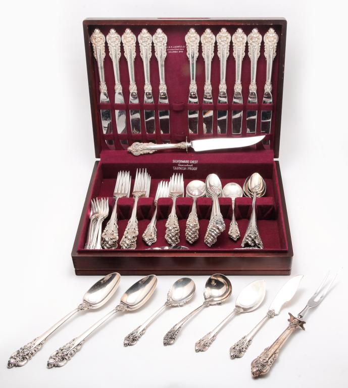 GRAND BAROQUE "STERLING" FLATWARE BY WALLACE.: American, 20th century. Eighty one pieces, partial service. Includes eleven each dinner knives, dinner forks, salad forks and soup spoons with monogram. Also, without monogram, eight seafood forks, ei