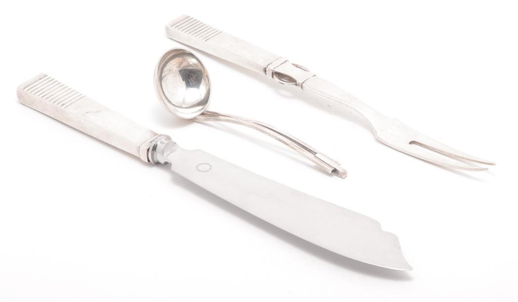 THREE PIECES GEORG JENSEN FLATWARE.: Sterling. Carving fork and knife, 9", 10"l. Denmark, 3rd quarter 20th century mark. And a small "Georg Jensen Inc. USA" ladle. 4.75"l.