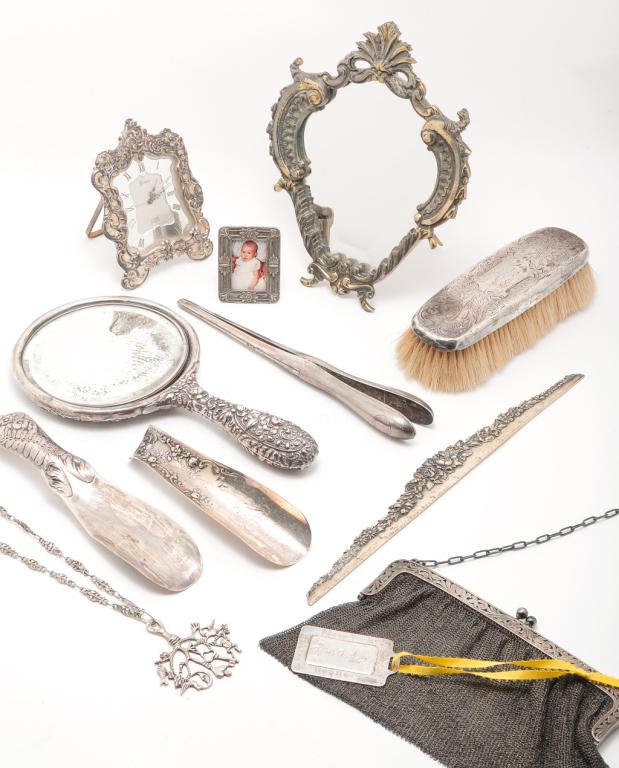GROUP OF SILVER AND SILVER PLATE ITEMS.: Late 19th-20th century. "Sterling" ruler, hand mirror, 10"l, two shoehorns, hairbrush, Kirk & Son luggage tag and clasp on a mesh purse. Unmarked "Gorham" clock, silverplate brass table mirror, 9"h. a