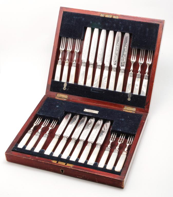 ENGLISH SHEFFIELD SILVER PLATE LUNCHEON SET.: Hallmarked 1916, maker's initials "GH". Twelve each forks and knives with brightwork and mother of pearl handles. Fitted wooden case labeled "Oswin & Co. Ltd. Silversmiths...Hereford". 2.25"H. 11.5"w.