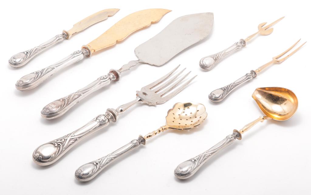 EIGHT PIECES OF RUSSIAN SILVER HANDLED FLATWARE.: Late 19th century. Service pieces with vermeil, and partial hallmarks on silver hollow handles. Possibly by Aleksey Osipov. Wear, scratches, loss to handle fill. 6.75" to 12.25"l.
