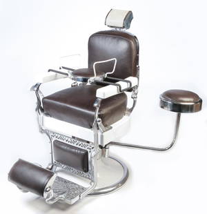 AMERICAN KOKEN BARBER CHAIR.: Ca. 1929. Hydraulic. Completely restored with black leather seat, back head and foot rests, white enameling and nickle plated and swivel side seat. Includes child's booster seat. 25" seat, 49"h.