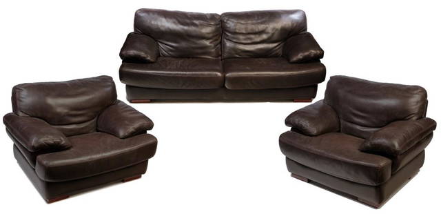 THREE PIECES OF ITALIAN LEATHER FURNITURE.: Late 20th century. Chocolate brown with slightly lighter stitching, deep plush cushions, backs and arms. Sofa, 17" seat, 36"h. 88"w. and two armchairs, 17" seat, 36"h. 48"w.