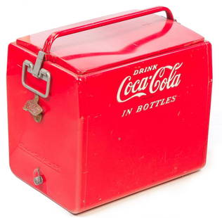 AMERICAN COCA-COLA COOLER.: Mid 20th century. Embossed steel cooler "Drink Coca-Cola in Bottles" with bottle opener and lift off top. Made by Cavalier Corp., Tennessee. Some wear. 18"h. 18"w. 13"d.