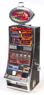 AMERICAN "HOT HOT SUPER JACKPOT" SLOT MACHINE.: By Respin, ca 2010. Five dials, sheet metal and chrome case. 68"h. 24.5"w. 25"d.