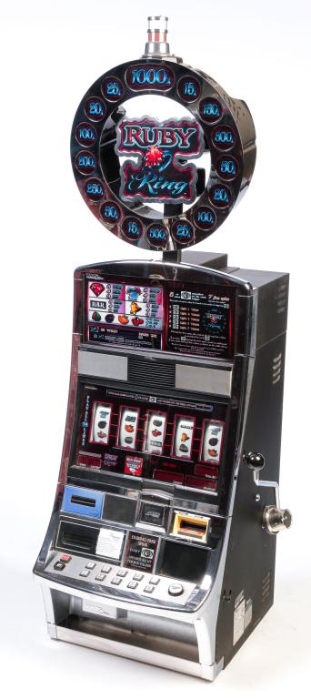 AMERICAN "RUBY RING" SLOT MACHINE.: Twenty first century. Five dials, sheet metal and chrome case. 72"h. 24.5"w. 26"d.