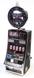 AMERICAN "RUBY RING" SLOT MACHINE.: Twenty first century. Five dials, sheet metal and chrome case. 72"h. 24.5"w. 26"d.