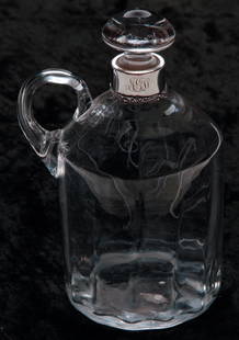 AMERICAN BLOWN GLASS "WHISKY" JUG.: Twentieth century. "Sterling" monogrammed neck. Applied handle and cut label. 7.5"h.