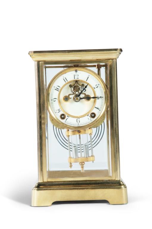 NEW HAVEN CRYSTAL REGULATOR CLOCK.: American, ca. 1900. Gilded brass case, beveled glass panes, brass works with open escapement, porcelain face marked "Made by New Haven Clock Co, New Haven, Conn. USA." 10"h. 6.25"w. 5"d.