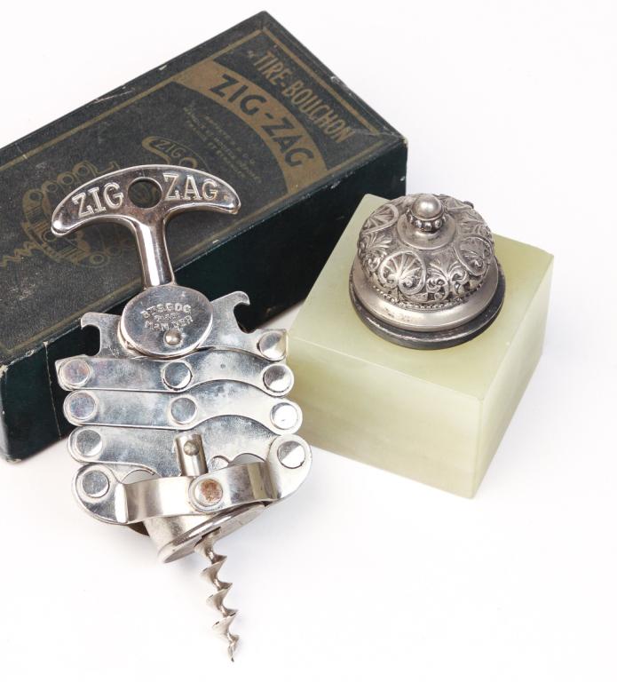 EUROPEAN INKWELL AND CORKSCREW.: First quarter 20th century. French "Zig Zag" cork screw in original box, 2.5"h. 6"w. 3"d. and a cube shaped alabaster inkwell with silver plated lid and glass liner. 3.5"h 2.5"sq.