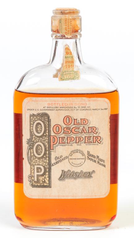 PRE-PROHIBITION OLD OSCAR PEPPER WHISKEY.: Frankfort, Kentucky, 1916. Unopened bottle, 100 proof. Distilled in the spring of 1916, and bottled 192__ (probably 1926). Remnants of the green and red bottling and tax strip on the neck. One Pint. F