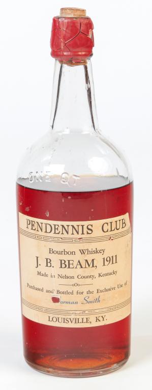 J.B. BEAM BOURBON WHISKEY, PENDENNIS CLUB.: Nelson County, Kentucky, ca 1911. Unopened bottle, approximately 1 quart. "Purchased and bottled for the Exclusive Use of Norman Smith". Beam crafted the 102-year old whiskey for the historic Pendenni