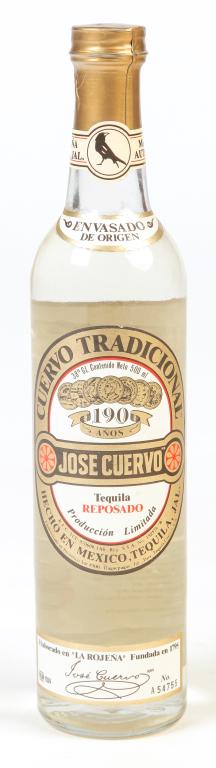 JOSE CUERVO TRADICIONAL REPOSADO TEQUILA.: Mexico, ca 1985. Unopened bottle. A pale straw-colored reposado made from 100% blue agave and rested in white oak barrels. Only a limited amount of this rare tequila is produced each year. Bottle numb
