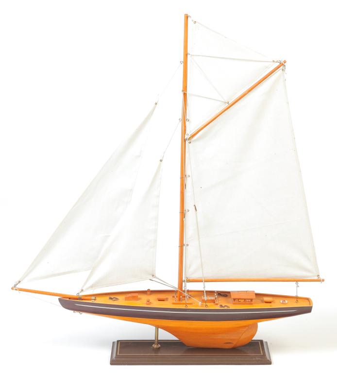 CHINESE POND SAILER.: Late 20th century, basswood and pine. Canvas sails. Single masted cutter. 23.5"h. 28"l. 4.25"w.