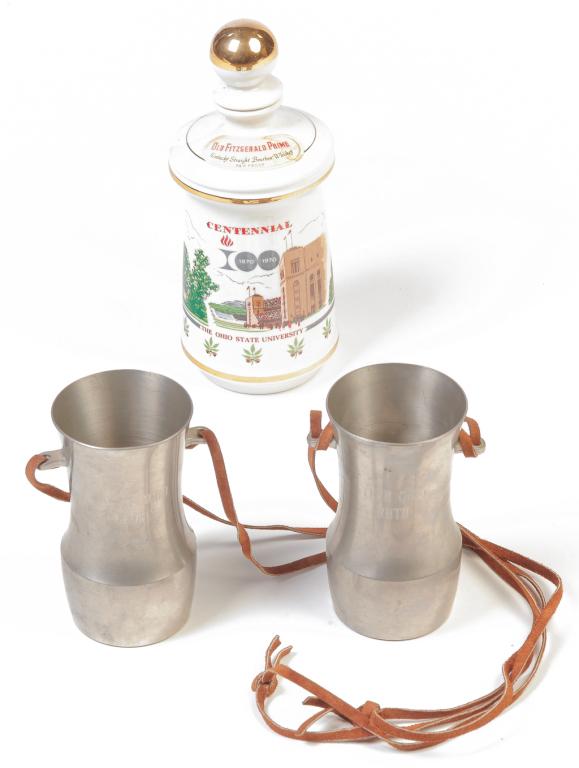 OSU PEWTER CUPS AND WHISKEY BOTTLE.: Pair of pewter cups made by Newbury Pewter, mid 20th century. Engraved "Yeah Ohio Ruth" "Yeah Ohio George" (Staten). With leather cords. 5.75"h. And a OSU 1870-1970 centennial porcelain whiskey "Old F