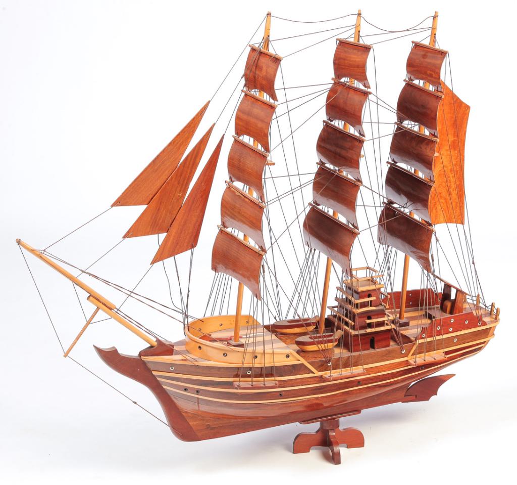 AMERICAN WINDJAMMER SHIP MODEL.: Twentieth century, teak and sapwood. Three masts, mid ship house and nicely modeled hull. 37"h. 40"l. 10"w.