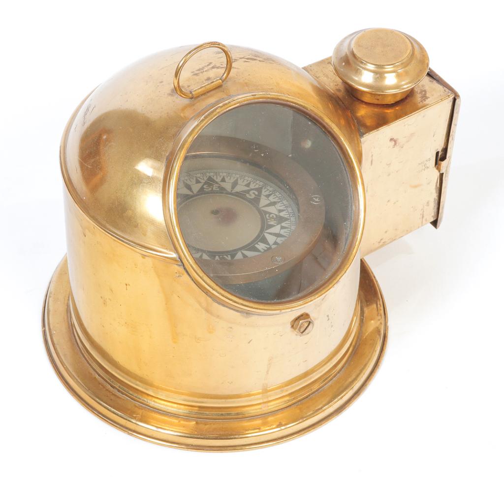 AMERICAN SHIP'S BINNICLE.: First half 20th century. Brass housing, compass with brass bezel and metal housing. Glass face is cracked and some dents to brass. 9.5"h. 10.5"w. 9"d.