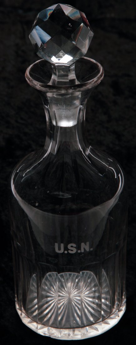 U.S. NAVY WARDROOM CUT DECANTER.: American, ca. 1900. Clear flint crystal with grey tinge, facet stopper, panel-cut neck, and base with starburst bottom. Etched "U.S.N." 11"h.