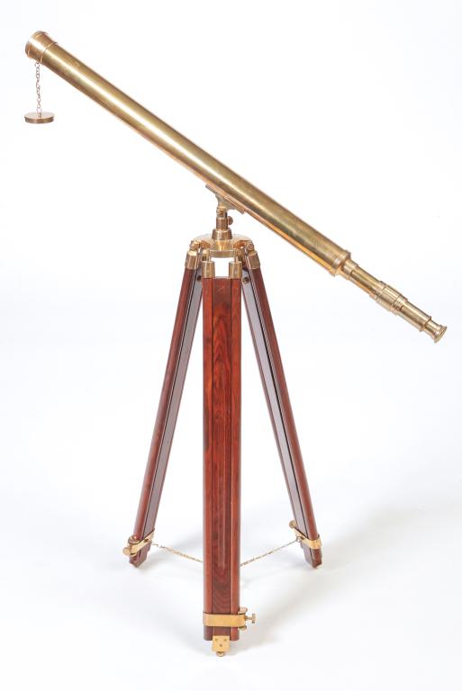 EUROPEAN BRASS TELESCOPE ON TRIPOD.: Late 20th century. Single tupbe on brass and mahogany base. Tube is 39"l.