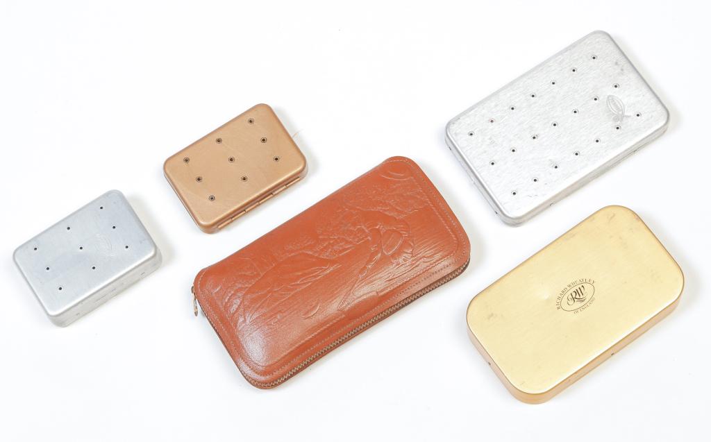 FIVE CASES OF FLY FISHING LURES.: Twentieth century. Wheatley, England with salmon flies, two American Perrines with flies, Japanese with a couple of flies, and an embossed leather zipper case with fishing scene.