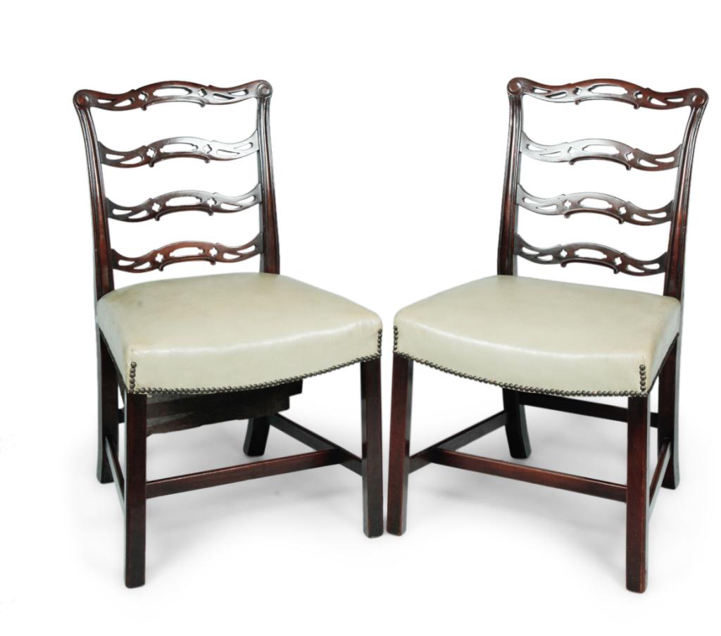 A PAIR OF CHIPPENDALE STYLE SIDE CHAIRS.: England, 2nd half-19th century. Mahogany. Ribbonbacks, square legs w/ beaded edge and upholstered seats w/ brass tack trim. 18 1/2'' seat height. 36 1/2'' h.