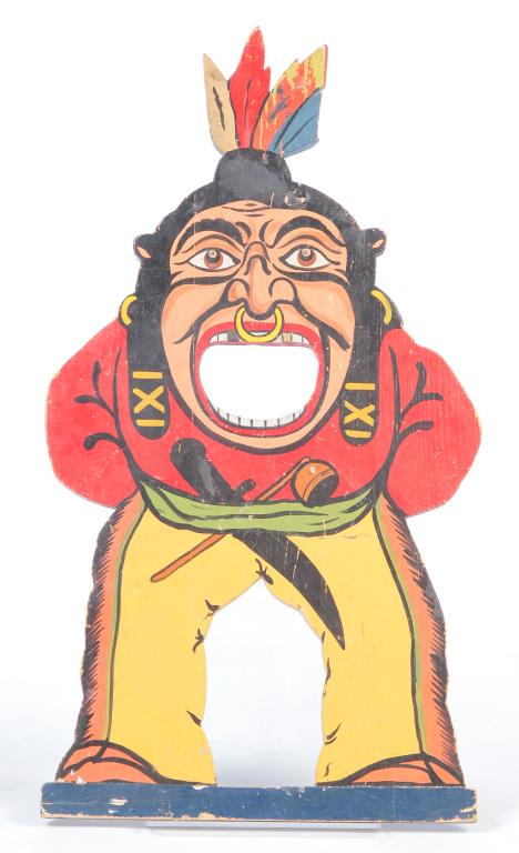AMERICAN CARNIVAL BEAN BAG TARGET.: Mid 20th century, pine. Cut out toss game with multicolored enamel paint depicting a Native American in buckskins. 29.25"h. 15"w.