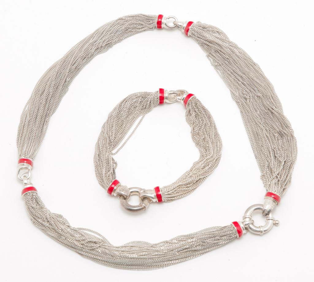 TIFFANY STERLING MESH CHAIN NECKLACE & BRACELET.: Italian, late 20th century. Tiffany & Co. Italian crafted sterling silver necklace and bracelet, featuring a multi-strand chain mesh design, embellished with hand-laid red enamel accents. Necklace mea