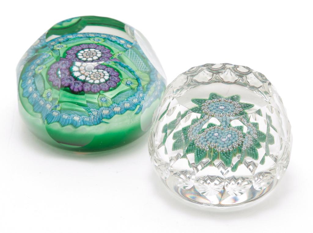TWO SCOTTISH PERTHSHIRE CUT PAPERWEIGHTS.: Second half 20th century. A table cut top, honeycomb sides and starburst base with eight point millefleur star with "P" cane center, 2.25"d. And a table cut top with circular panel sides, green ground