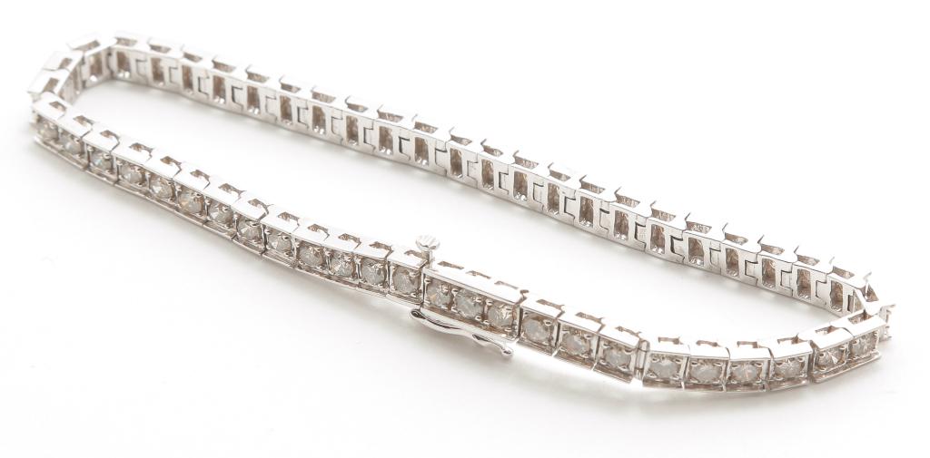 BOX LINK DIAMOND TENNIS BRACELET - 4.86 CARATS.: American, 21st century. 14K white gold box link bracelet, 51 round brilliant diamonds, estimated total diamond weight 4.86cts., clarity SI, color K/L. Approx. 8"l, 4.5mm wide, concealed clasp with saf