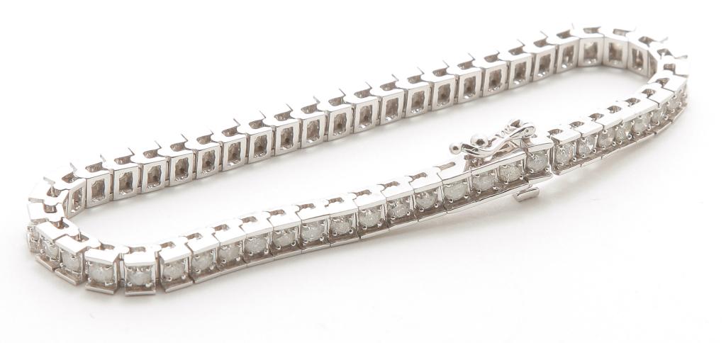 WHITE GOLD DIAMOND TENNIS BRACELET - 4.25 CARATS.: American, 21st century. 14K white gold box link tennis bracelet, 52 round brilliant diamonds, estimated total diamond weight 4.25cts., clarity I, color I. Approx. 7"l, concealed clasp with safety, 17g